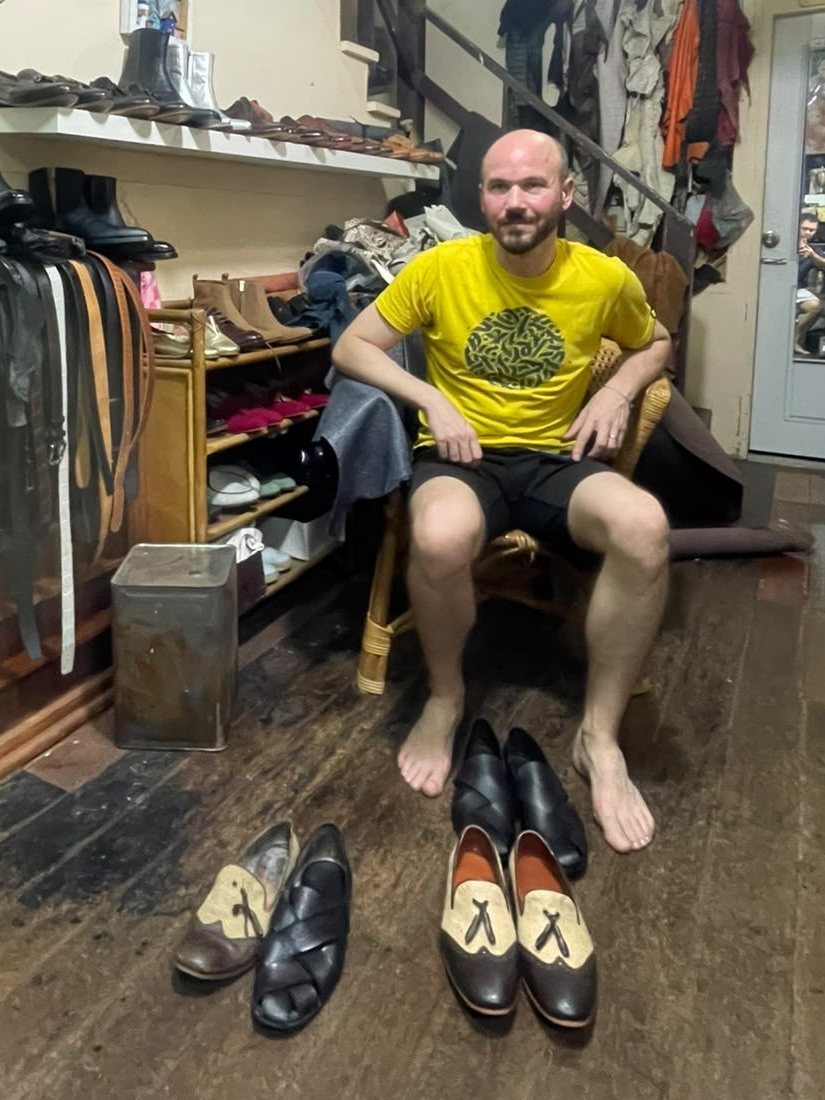 A client with his finished pairs: tassel loafers and woven-strap shoes