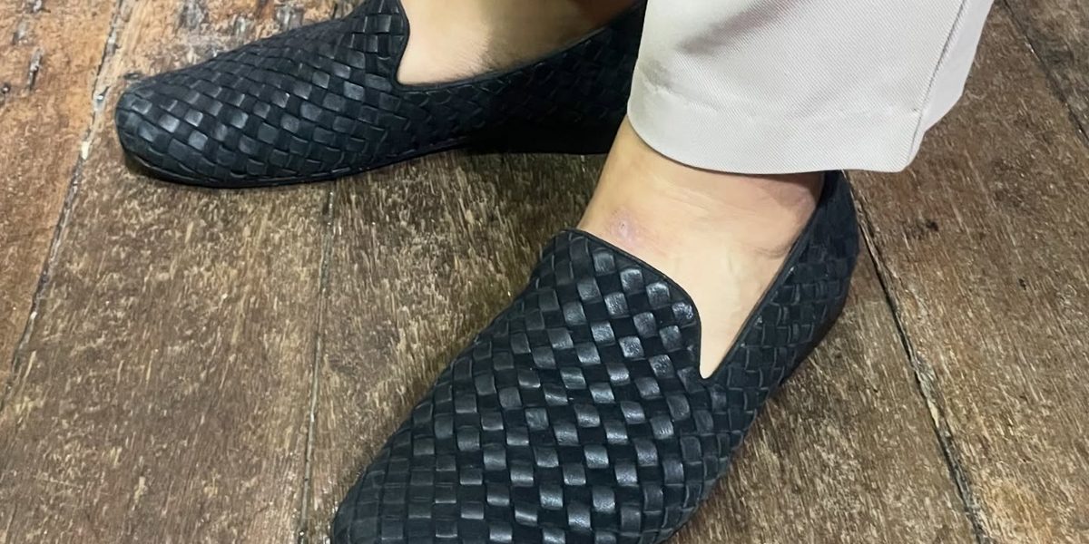 Black woven-leather loafers