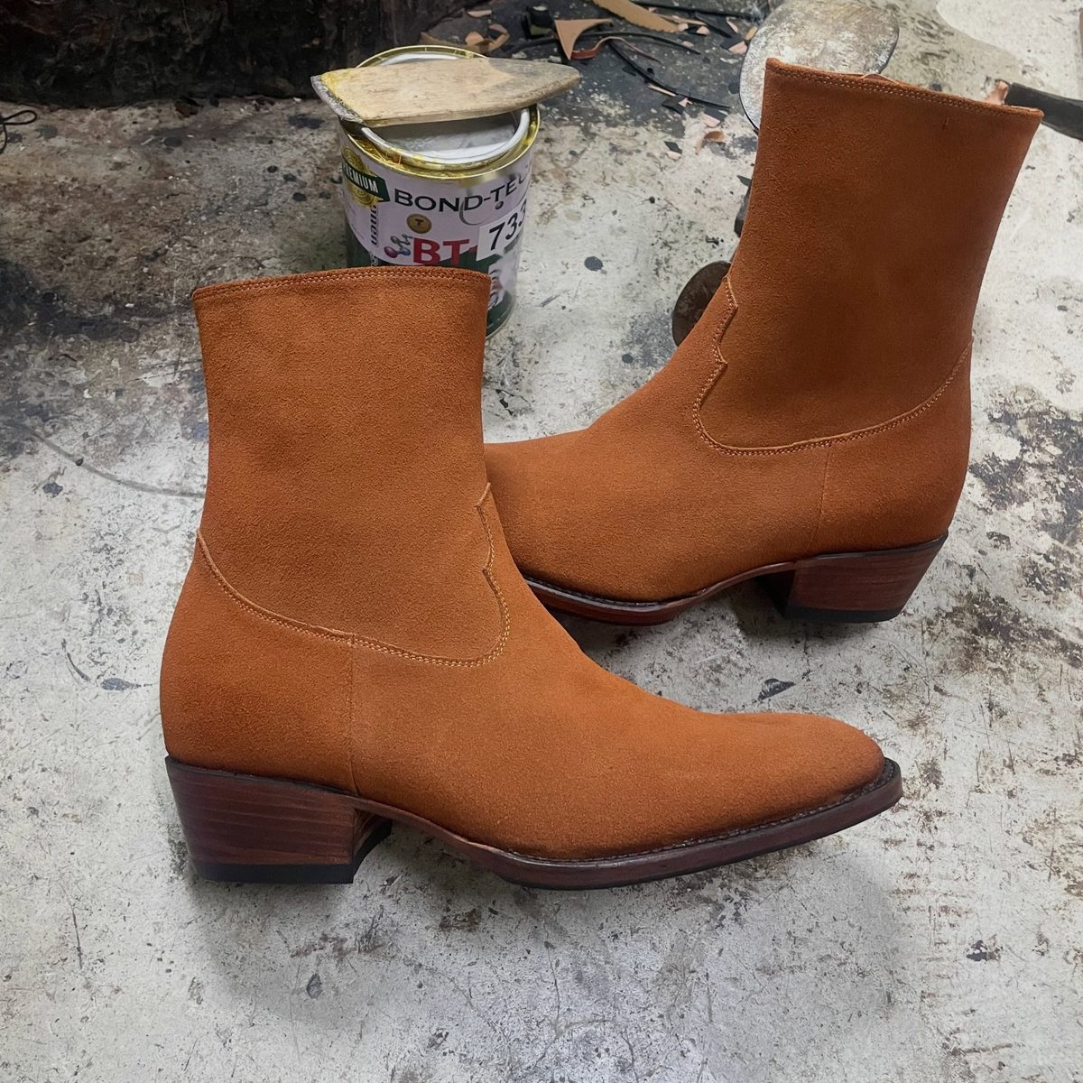 Rust suede side-zip boots on a block heel